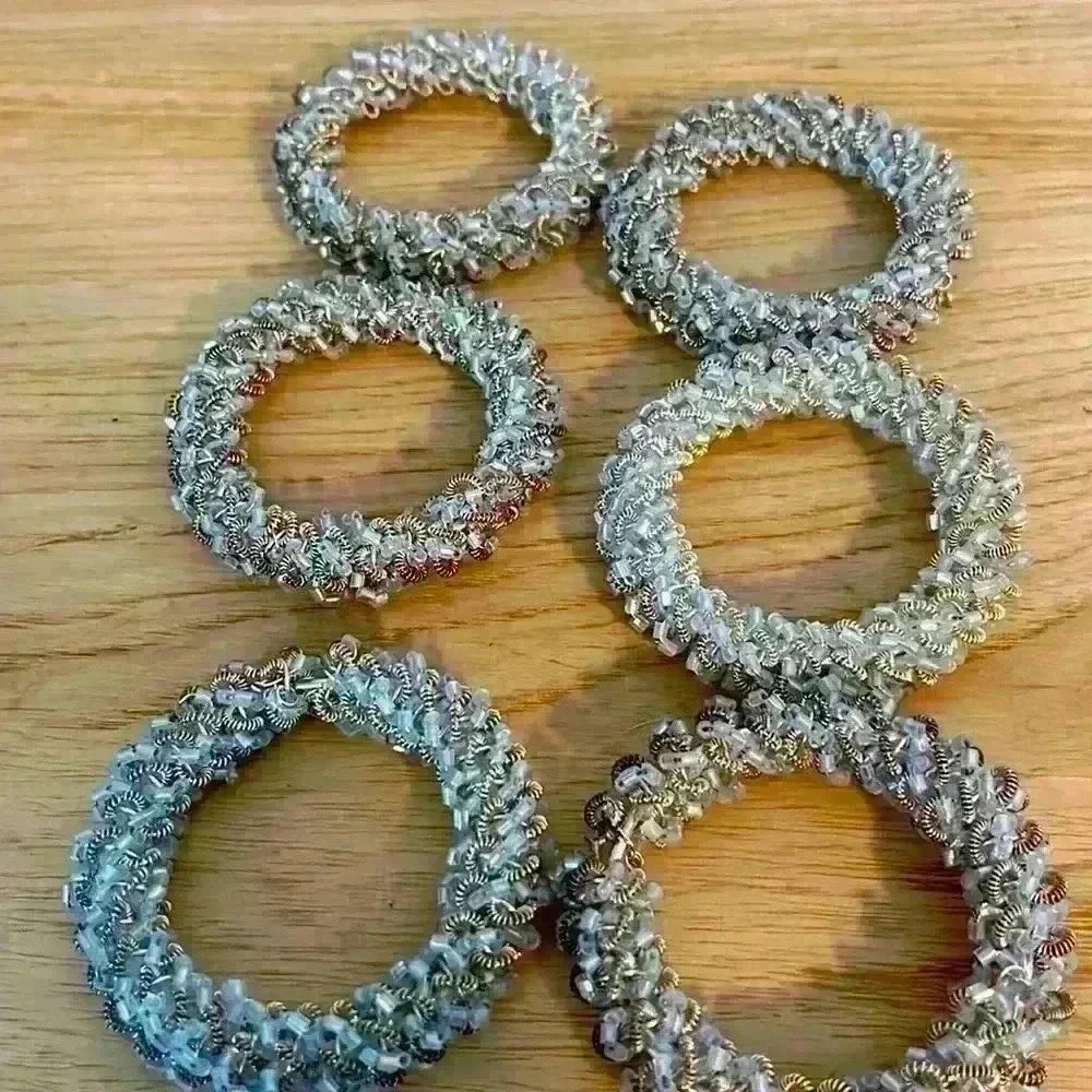 Crate and barrel napkin rings, set of six white, silver and gold